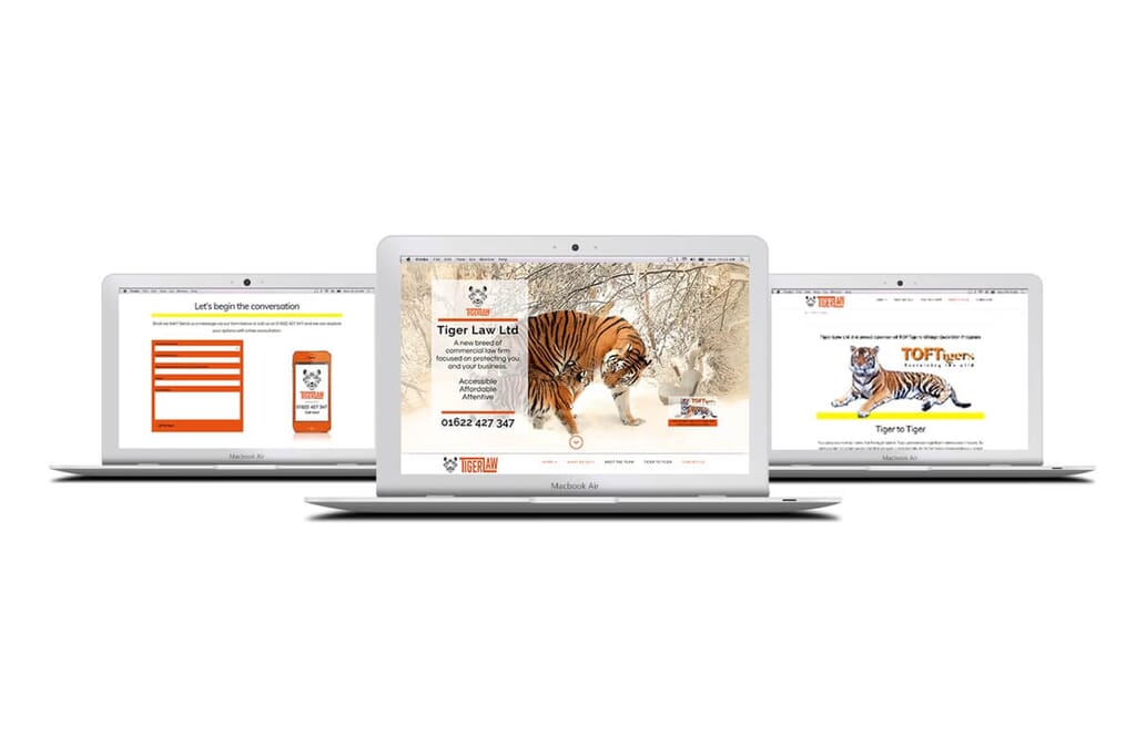 website mockup display showing site made by Here's the Cavalry on silver laptops